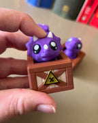 Dino in a Crate Clicker Fidget Toy
