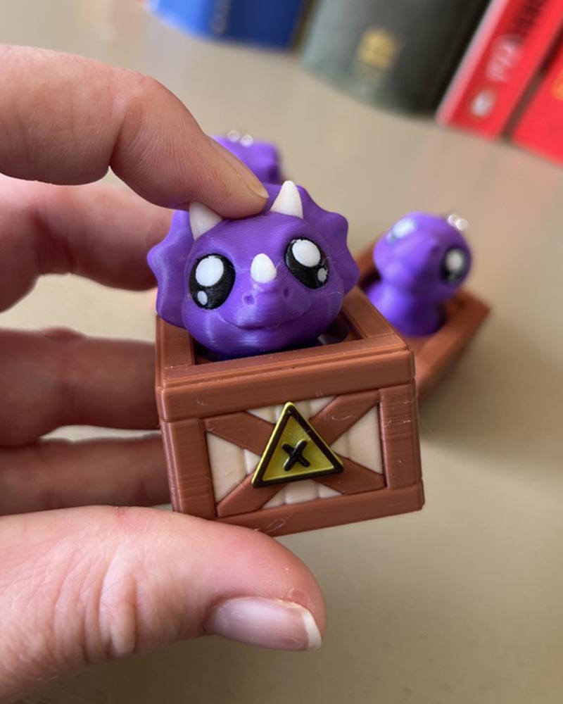 Dino in a Crate Clicker Fidget Toy