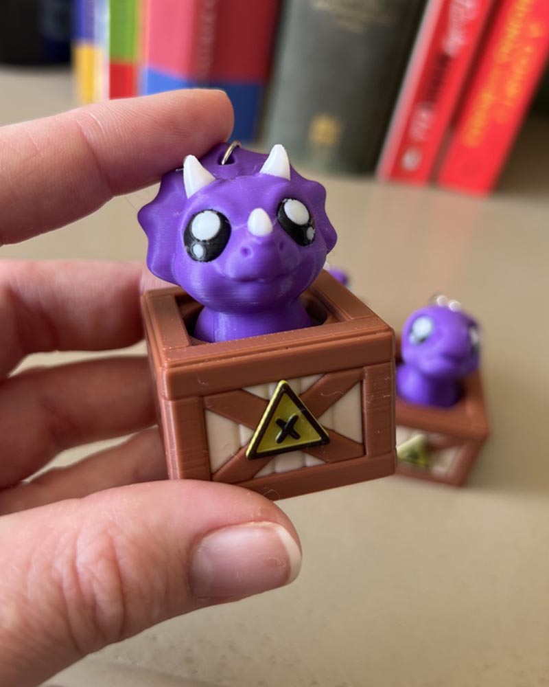Dino in a Crate Clicker Fidget Toy