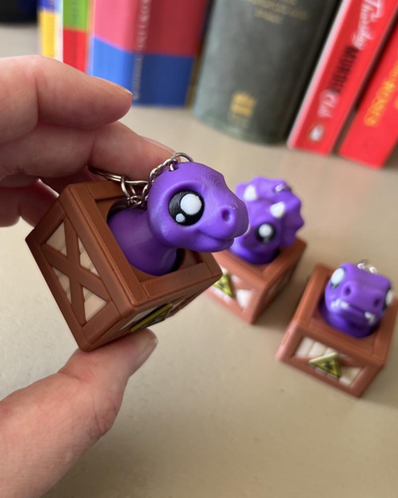 Dino in a Crate Clicker Fidget Toy