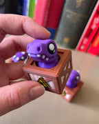 Dino in a Crate Clicker Fidget Toy